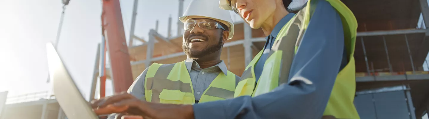 Two workers at jobsite