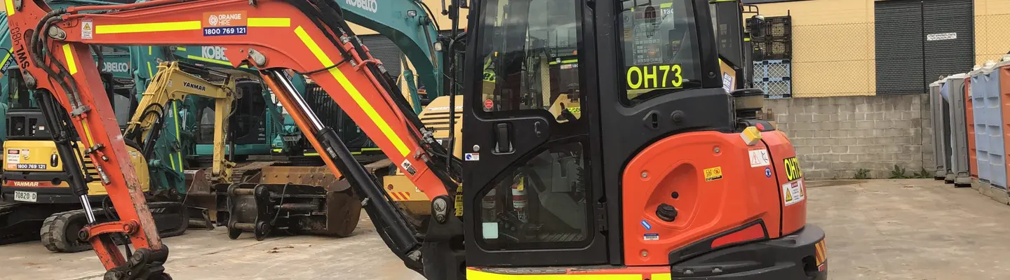 Construction equipment such as excavators and loaders at a worksite, illustrating tools essential for building and infrastructure projects.