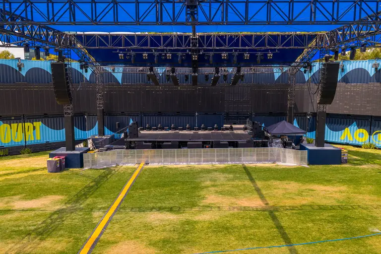 A fully custom, container-based stage and breakout area for the Australian Open, featuring a 45-meter TV façade and modular installations.