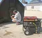 Red and black MI-T-M 7,500-7,900 W Portable Generator, Gas