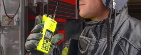 Worker using a 2-way radio