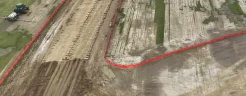 Timber mats at muddy jobsite