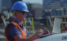 woman on jobsite with laptop