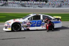 sheldon creed next to his car 