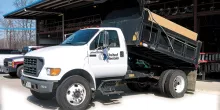 white dump truck unloading