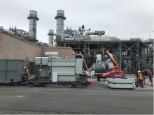 construction equipment and generators outside of power plant