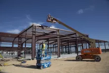 Workers on lifts