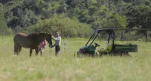 People with a UTV and a horse
