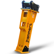 Rockbreaker attachment mounted on excavator, used for breaking large rocks at a protected construction site.