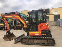 Construction equipment such as excavators and loaders at a worksite, illustrating tools essential for building and infrastructure projects.